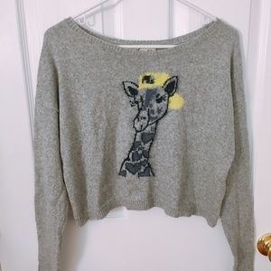 Giraffe with a yellow cap sweater